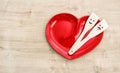 Red heart plate wooden kitchen utensils Funny tools food Royalty Free Stock Photo