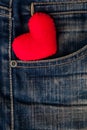 Red Heart put on an old blue jeans. Means love for denim. Royalty Free Stock Photo