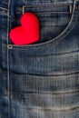 Red Heart put on an old blue jeans. Means love for denim. Royalty Free Stock Photo