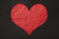 Red heart, red crumpled leather and black leather texture background