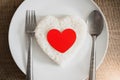 Red heart on rice heart shape on whiteplate