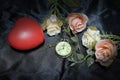 Red heart and rose with vintage gold pocket watch on black fabric background. Love of time concept. still life style Royalty Free Stock Photo