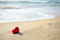 Red heart on sea beach - love relax concept Royalty Free Stock Photo