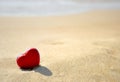 Red heart on sea beach - love Valentine's Day concept Royalty Free Stock Photo