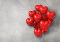 Red heart shape air balloons group on a concrete wall banner Royalty Free Stock Photo