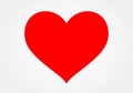 Red heart shape centered on a light gray background. The heart is bold Royalty Free Stock Photo