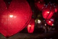 Red heart shape lamp in dark night.Photo of nightlight in the shape of a heart at the restaurant Royalty Free Stock Photo