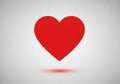 A red heart shape on a light gray background. The heart is Royalty Free Stock Photo