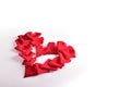 Red heart shape of rose petal flower on white background, image romantic love symbol Royalty Free Stock Photo