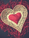 Red heart shape on shredded paper, vintage colors Royalty Free Stock Photo
