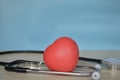 Red heart shape and stethoscope on wooden table Royalty Free Stock Photo