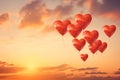 Red heart-shaped balloons in the sky at sunset.Valentine\'s Day banner with space for your own content. Whiteground color. Royalty Free Stock Photo