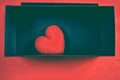 Red heart-shaped in a black gift box for a Valentine`s day. Royalty Free Stock Photo