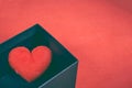 Red heart-shaped in a black gift box for a Valentine`s day. Royalty Free Stock Photo