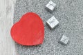 Red heart shaped box on a knitted sweater. Silver gift boxes. Fa Royalty Free Stock Photo