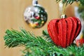 Red heart shaped Christmas decoration on Christmas tree Royalty Free Stock Photo