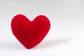Red heart shaped fabric on white background