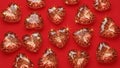 Red Heart-Shaped Gems on Red Background Royalty Free Stock Photo
