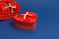 Red heart shaped gift box on blue background Royalty Free Stock Photo