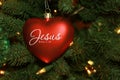 Red Heart Shaped Jesus Christmas Ornament On Tree