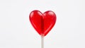 Red heart shaped lollipop with a white background Royalty Free Stock Photo