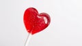 Red heart shaped lollipop with a white background Royalty Free Stock Photo