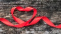 Red heart shaped ribbon awareness for World aids day campaign supporting people with HIV, STD disease Royalty Free Stock Photo