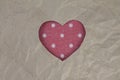 Red heart shaped slot in craft paper. Royalty Free Stock Photo