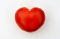 Red heart shaped tomato on white background close up. Royalty Free Stock Photo