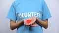 Red heart sign in volunteer palms, health care, transplantation center, medicine Royalty Free Stock Photo