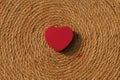 Red heart on spiral rope texture. Valentine heart. Royalty Free Stock Photo
