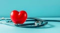 A red heart and a stethoscope on a blue background Royalty Free Stock Photo