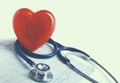 Red heart and a stethoscope on cardiagram Royalty Free Stock Photo