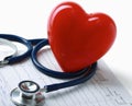Red heart and a stethoscope on cardiagram Royalty Free Stock Photo