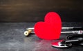 Red heart and stethoscope. The concept of medicine and health insurance, family, life. Ambulance. Cardiology Healthcare. Royalty Free Stock Photo