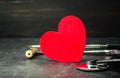 Red heart and stethoscope. The concept of medicine and health insurance, family, life. Ambulance. Cardiology Healthcare. Royalty Free Stock Photo