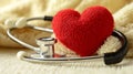 A red heart and a stethoscope on a light background, area for text Royalty Free Stock Photo