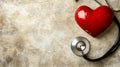 A red heart and a stethoscope on a light background, area for text Royalty Free Stock Photo