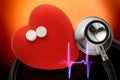 Red heart, stethoscope and pills Royalty Free Stock Photo