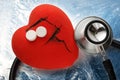 Red heart, stethoscope and pills Royalty Free Stock Photo