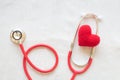 Red heart and stethoscope on white isolated background, copy space. Concept for heart health, cardiology, insurance plan, organ Royalty Free Stock Photo