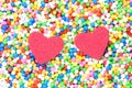 2 Red heart surrounded by colourful candy balls Royalty Free Stock Photo