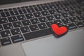 red heart symbol on laptop keyboard. online dating