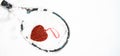 Red heart on tennis racket on white snow winter background. I love you tennis player on Valentine`s day. concept with tennis play. Royalty Free Stock Photo