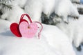 Red heart toy in snow on fir Royalty Free Stock Photo