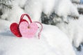 Red heart toy in snowfall on fir Royalty Free Stock Photo