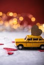 Red heart on toy yellow  taxi car on red background. Travel love concept with copy space Royalty Free Stock Photo