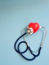 Red heart using deep blue stethoscope on the blue background for hear their own heart. Concept of love and caring patient by the h Royalty Free Stock Photo