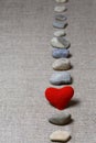 Red heart in vertical row of stones Royalty Free Stock Photo