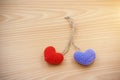 Red heart and violet heart made from Yarn place on wooden background Royalty Free Stock Photo